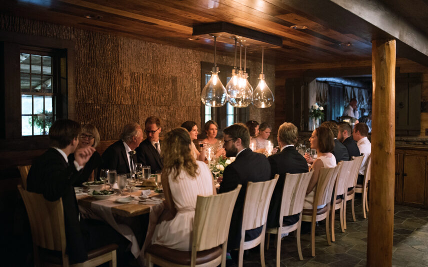 Wedding party of fifteen enjoying dinner at Gateway Lodge in Cook Forest, Pennsylvania.