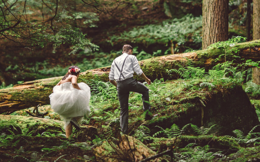 Wedding couple exploring the forest during their Gateway Lodge elopement in Cook Forest, Pennsylvania.