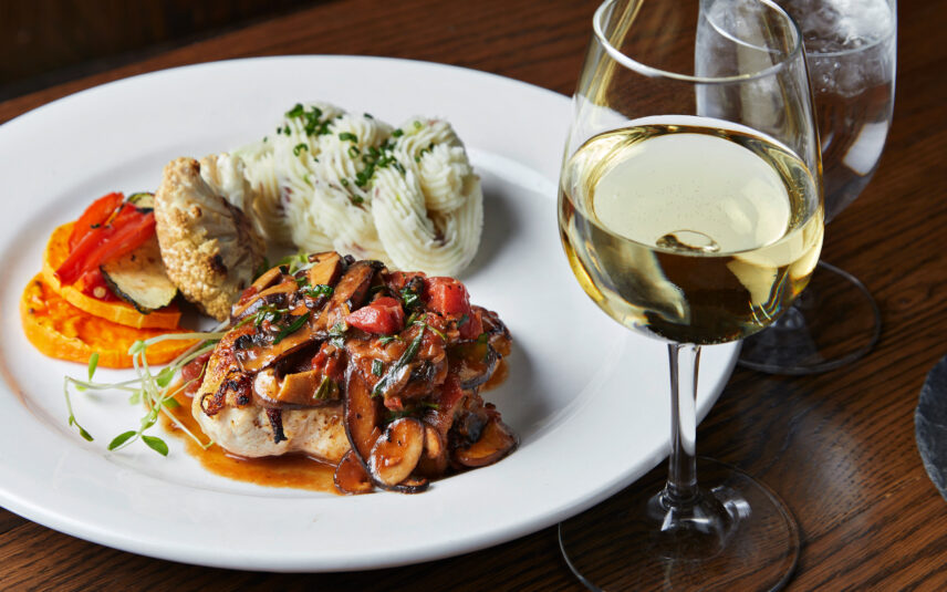 Organic chicken breast with forest mushrooms, tomatoes, and shallots in a cognac white wine reduction, served with redskin mashed potatoes and seasonal vegetables at Gateway Lodge, Cook Forest State Park, PA.